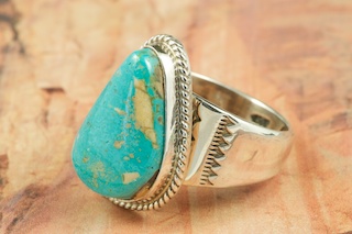 Genuine Blue Ridge Turquoise set in Sterling Silver Ring. Created by Navajo Artist Thomas Chischilly. Signed by the artist. Blue Ridge Turquoise is mined in Lander County, Nevada.